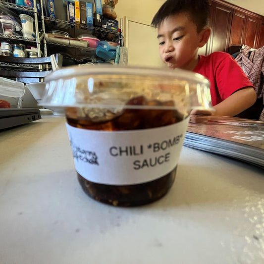 Cillian Tran and Starry Kitchen Chili *bomb* sauce. Medium Asian Spicy. Great on it's own or mixed with Lao Gan Ma or Fly by Jing